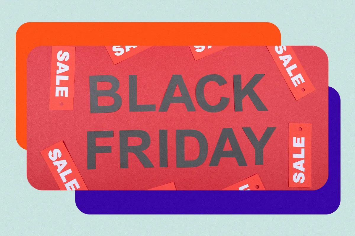 Black letters spelling Black Friday on a red background with SALE tags, over orange and purple rectangles