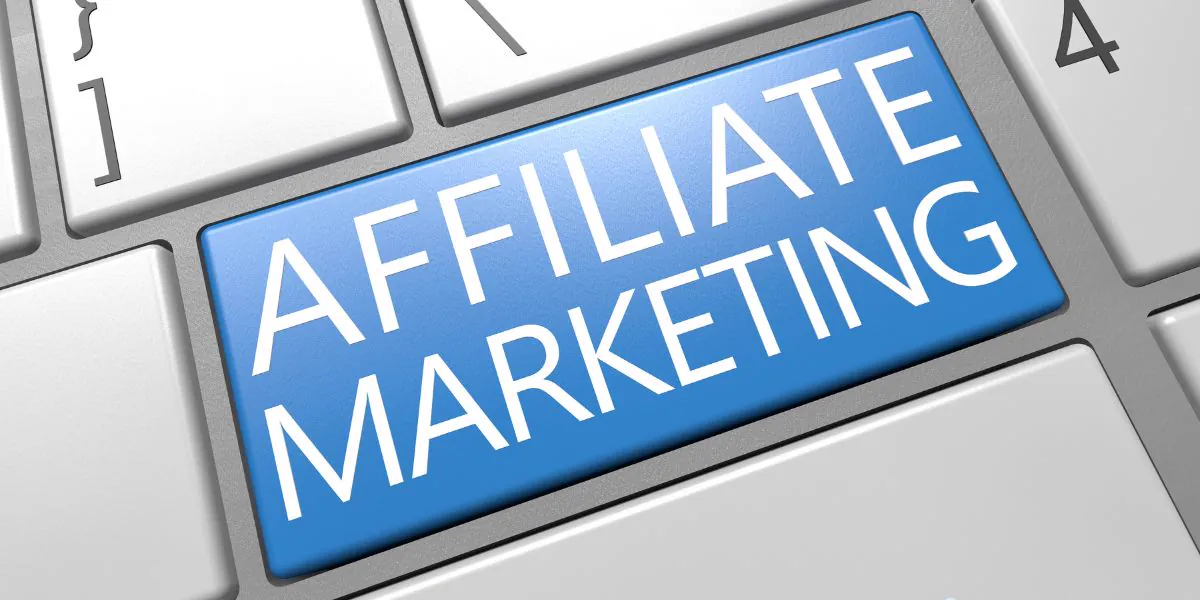 Blue key with the words Affiliate Marketing on a white keyboard, symbolizing conversion strategies for affiliates